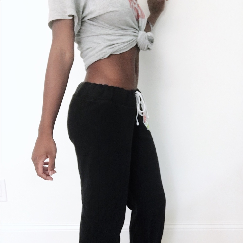 Black sweatpants with heart logo